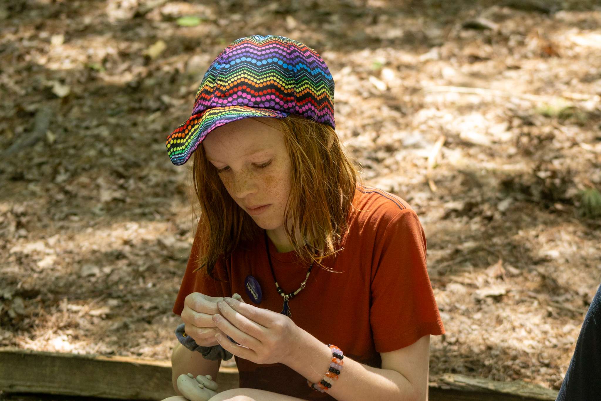 Camper making something out of clay.
